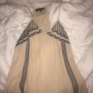 Tan tank top with navy detailing.